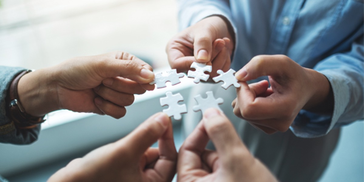 vision-mission Hands put puzzle pieces together